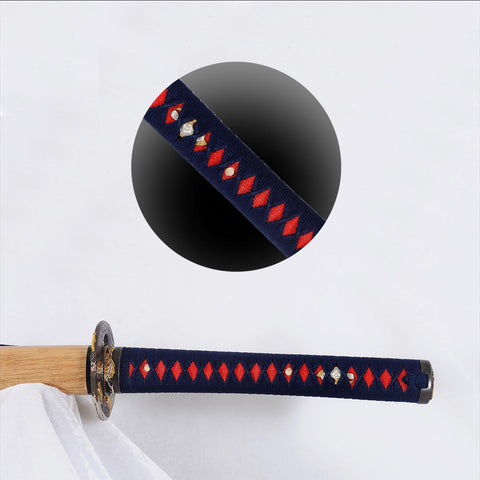 Hardwood handle wrapped in blue synthetic silk ito with genuine rayskin panels on sakabato katana