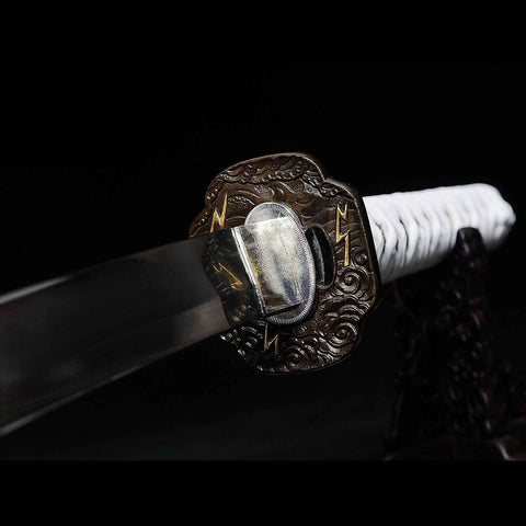 Close-up of the brass tsuba with Sakai Clan design
