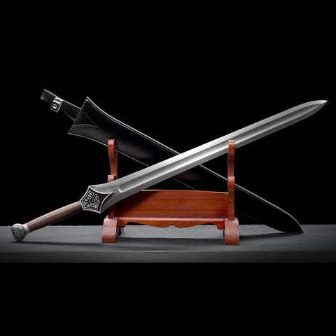 Angled view of hand forged Conan sword replica featuring broad 8.5 cm Damascus steel blade