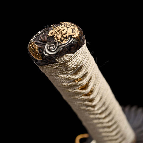 Handcrafted pure copper fittings with gold and silver detailing on katana