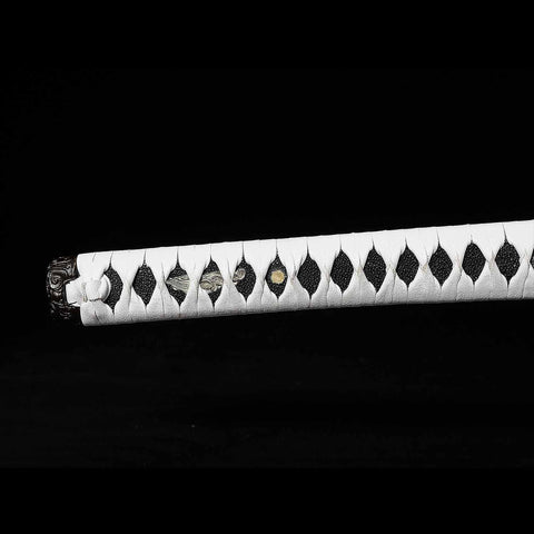 Detailed view of the hardwood and rayskin wrapped tsuka of the katana