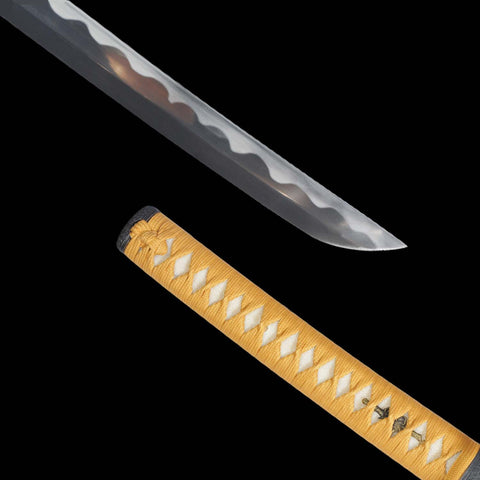 Hardwood tsuka handle wrapped with genuine rayskin and synthetic silk ito on sakabato katana